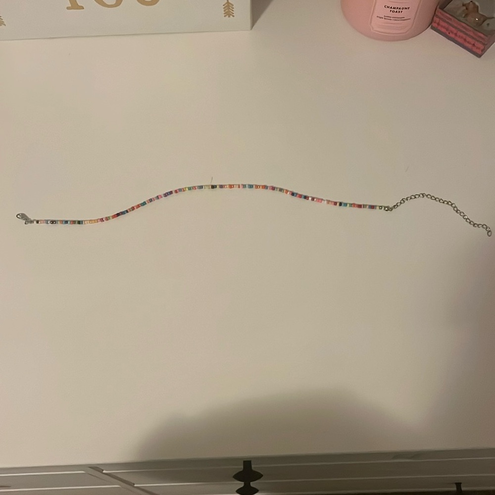 a beaded necklace with a variety of colors.